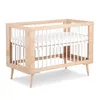 A wooden crib with white bars and a white mattress is shown against a white background. Náhľad obrázku produktu