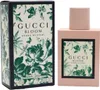 Gucci Bloom Acqua di Fiori Eau de Toilette in rosa Flakon mit floralem Etikett, daneben passende grün-beige Box mit Blumen- und Schmetterlingsmuster. Produktbild-Vorschau