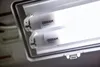 Close-up of two fluorescent light tubes inside a fixture. Podgląd zdjęcia produktu