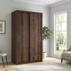 A sliding door wardrobe is shown in a room with a window and a chair. Produktbild-Vorschau