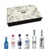 A tasting box with six miniature bottles of vodka arranged below it. Produktbild-Vorschau