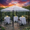 An outdoor event setup under a transparent pavilion during a rain shower. Produktbild-Vorschau
