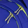 Close-up view of zippers and drawstrings on a blue backpack. Náhled obrázku produktu
