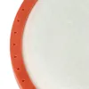 A close-up, partial view of an orange ring with small holes surrounding a white, textured surface. Produktbild-Vorschau