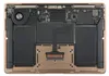 The internal components of a laptop, including the battery, fan, and motherboard, are visible. Náhled obrázku produktu