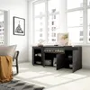 A modern living room with a sideboard featuring an electric fireplace, large windows, and a framed picture of the Eiffel Tower. Produktbild-Vorschau
