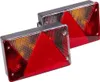 Two rectangular trailer lights with red and amber triangular sections, mounted on a white background. Produktbild-Vorschau