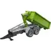 A green skip loader trailer with a grey chassis and wheels, shown from a side-angle. Voir les images du produit