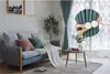 A living room scene with a sofa, curtains, and a coffee table. Produktbild-Vorschau