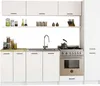 A clean, modern kitchen setup with white cabinets, a sink, a stove, and various kitchenware on shelves. Voir les images du produit