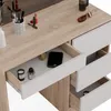 A close-up view of a vanity table with drawers open, showing makeup and a smartphone. Náhled obrázku produktu