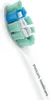 A close-up shot of a Philips Sonicare toothbrush head with blue, green, and white bristles. Náhľad obrázku produktu