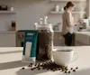 A kitchen scene with coffee-making elements and a water filter. Produktbild-Vorschau