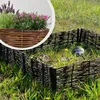 Three tortoises are in a grassy enclosure surrounded by a woven fence. A close-up inset shows a planter with lavender and pink flowers. Produktbild-Vorschau