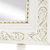 A close-up view of the corner of a white mirror frame with ornate gold detailing. Náhľad obrázku produktu