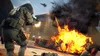 A scene of intense combat with soldiers, explosions, and fighter jets in the sky. Podgląd zdjęcia produktu