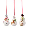 Three ceramic snowman ornaments hanging from red ribbons against a white background. Podgląd zdjęcia produktu