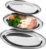 Three oval stainless steel serving platters are stacked on a white background. The middle platter contains a serving of sliced meats, broccoli, and carrots. Produktbild-Vorschau