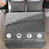 A top-down view of a bed with gray bedding, including pillows and a comforter. Overlay icons highlight product features. Produktbild-Vorschau