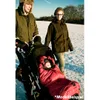 A family walking in the snow with a baby in a stroller. Produktbild-Vorschau