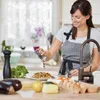 A woman is in a kitchen, seasoning a plate of food. Voir les images du produit