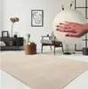 A living room scene with a rug, chair, and side table. Produktbild-Vorschau