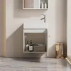 A modern bathroom vanity with a sink, cabinet, and faucet. Anteprima dell’immagine prodotto