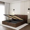 A bed with its storage compartment open, in a bedroom setting. Produktbild-Vorschau
