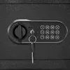 A close-up view of a safe's electronic keypad and key lock mechanism. Produktbild-Vorschau