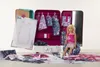 A Barbie doll sitting in a fashion salon playset, surrounded by fabric scraps and dress templates. Produktbild-Vorschau