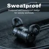 Close-up of black in-ear headphones with water droplets on them, set against a dark, textured surface. Produktbild-Vorschau
