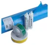 A collection of construction sealing products including a roll of blue vapor barrier, two tubes of sealant, and rolls of green and yellow tape. Produktbild-Vorschau