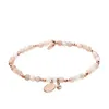 A bracelet made of beads and charms on a white background. Anteprima dell’immagine prodotto
