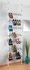 A tall, white, extendable shoe rack filled with various types of shoes is shown against a lightly gray-walled background. Náhled obrázku produktu