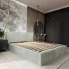 A bedroom with a bed, wardrobe, and decorative elements. Produktbild-Vorschau