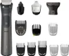 A collection of grooming attachments and a trimmer are displayed against a white background. Produktbild-Vorschau