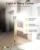 A yellow tripod work light illuminates a room under renovation, with text overlays highlighting its uses. Voir les images du produit