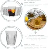 Collage of images showing classic glass tumblers, one filled with a drink and lemon, and another empty. Produktbild-Vorschau