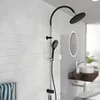A modern bathroom shower fixture with a rain showerhead and a handheld shower. Produktbild-Vorschau