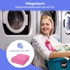 A woman is smiling while holding laundry and detergent in front of washing machines. There is a circular graphic overlay with product information and an image of a pink folded item. Produktbild-Vorschau