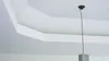 A white ceiling with a pendant light fixture. Produktbild-Vorschau