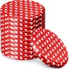 A stack of red jar lids with white heart patterns and a single lid placed in front of the stack. Podgląd zdjęcia produktu