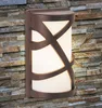 An outdoor wall light fixture mounted on a stone wall. Náhled obrázku produktu