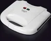 A white waffle maker is shown against a black background. Anteprima dell’immagine prodotto