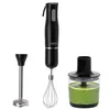 A black immersion blender with accessories and a container of green smoothie against a white background. Produktbild-Vorschau