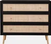 A chest of drawers with a black frame and cane webbing. Produktbild-Vorschau