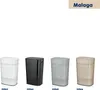 Four laundry baskets in different colors are displayed side-by-side on a white background. The text 'Malaga' is visible in the top right corner. Produktbild-Vorschau