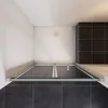 A top-down view of a shower enclosure with glass doors and a white shower tray. Produktbild-Vorschau