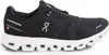A side view of a black and white running shoe against a white background. Anteprima dell’immagine prodotto
