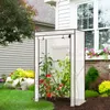 A small greenhouse with tomato plants inside, placed on a lawn next to a house. Produktbild-Vorschau